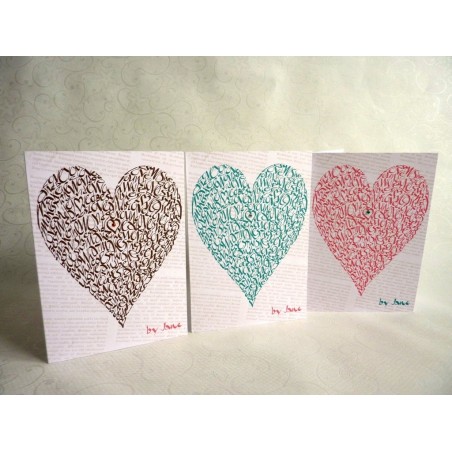 Handmade Valentine's card with love quotes and heart design in three colours