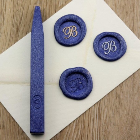 Shimmering metallic blue wax seal impression on envelope