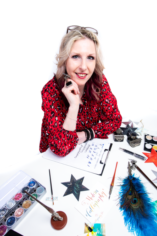 Jane Lappage at her calligraphy studio desk